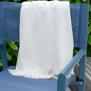 Serviette de plage en coton beige avec franges